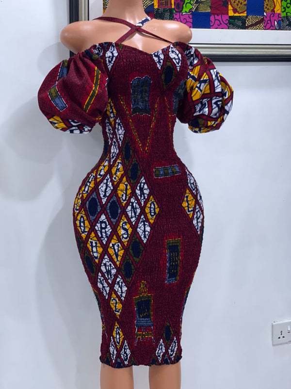 Criss cross neckline smoked dress in red ankara